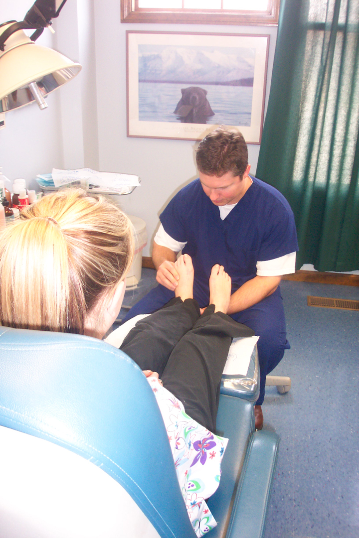 Dr. Fosdick examines feet