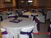 Hall with tables setup in purple theme