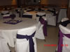 Hall with tables setup in purple theme